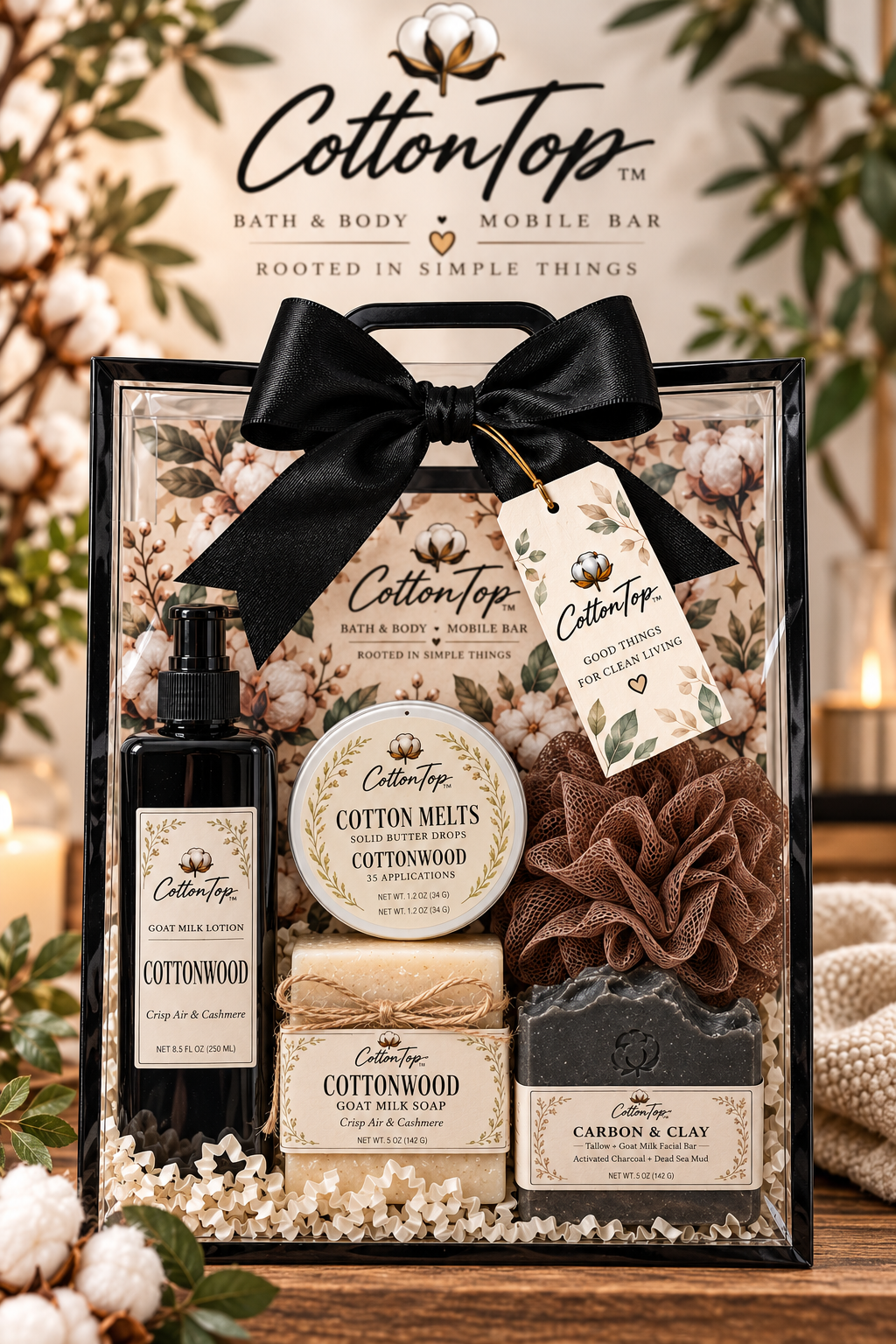 The Whole Cotton clear rectangular gift box with black bow, lotion, Cotton Melts, two full-size soaps, soap tray, loofah holder, filler and gift tag